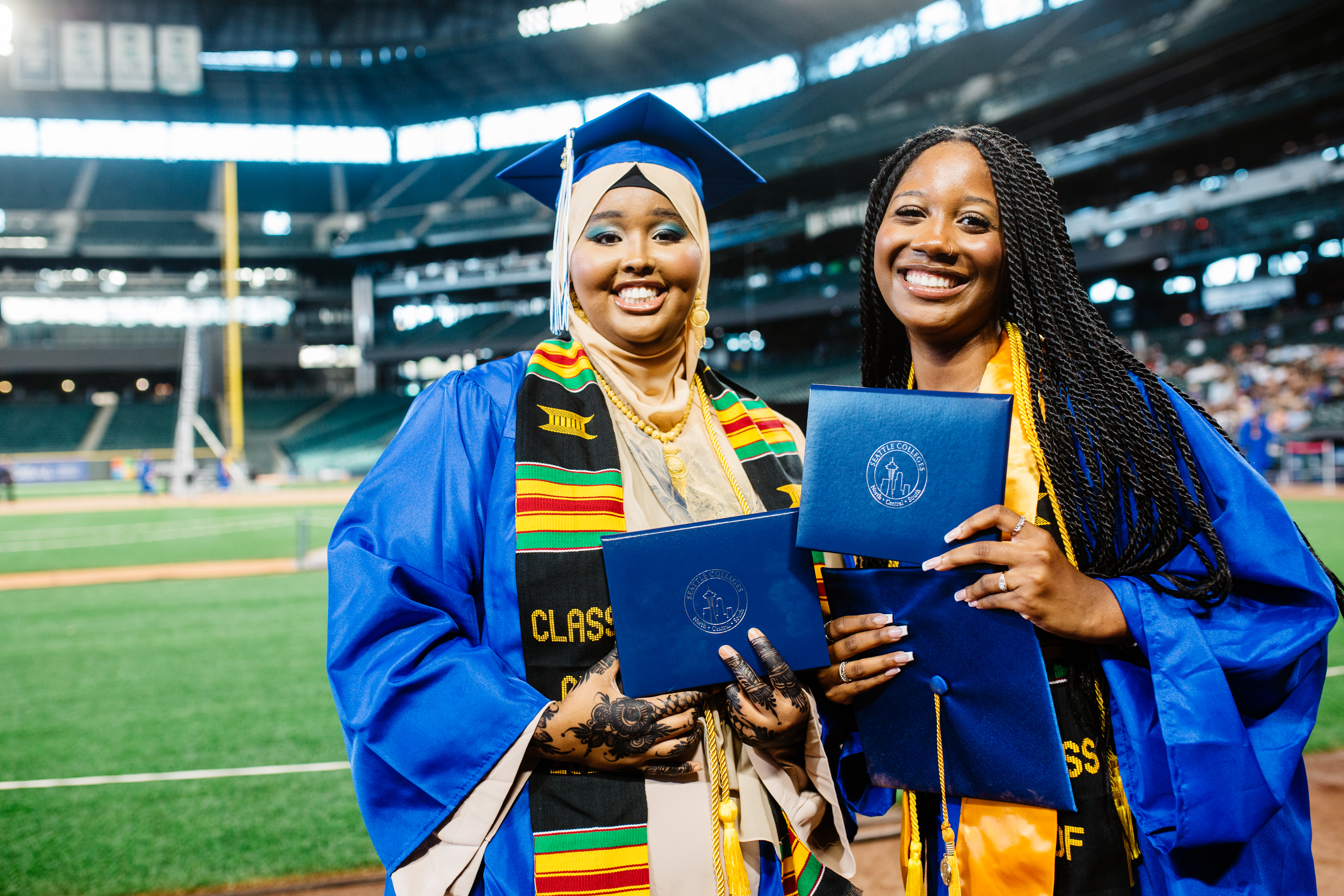 Two students smiling at Commencement