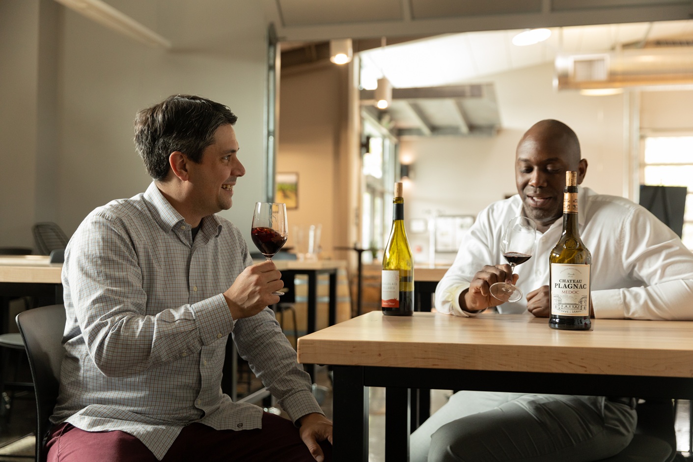 Two men sip wine in the Northwest Wine Academy's tasting room at South Seattle College