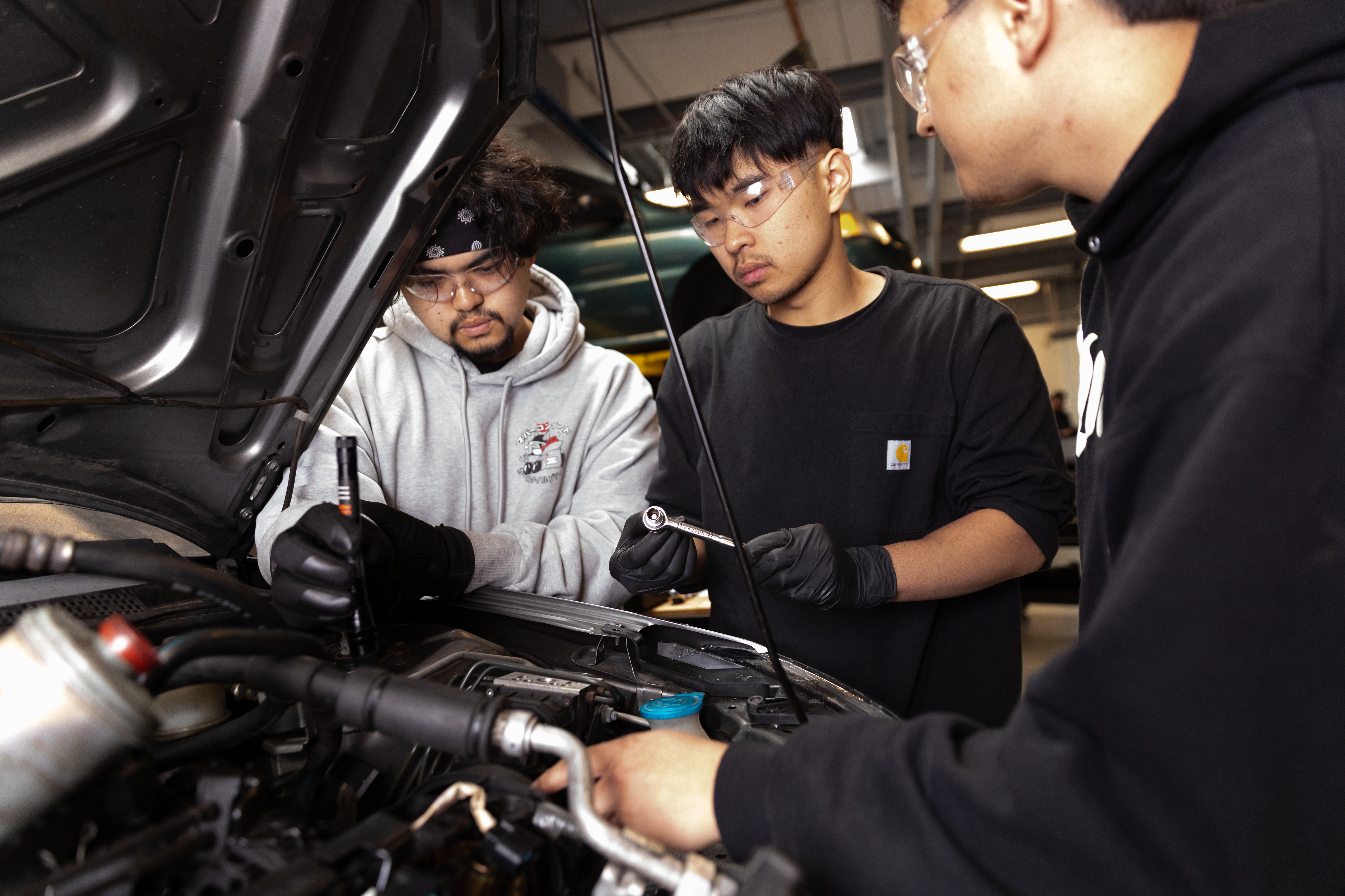 Automotive technology students working on a car at South Seattle College 