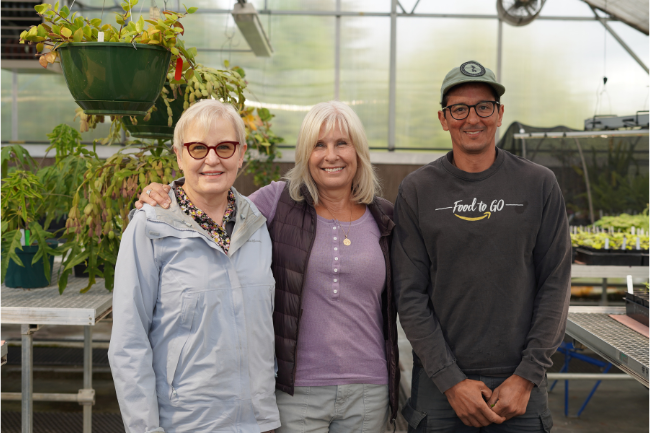 Shelley (center) poses with fellow Garden Center employees Glenda (left) and Ronei (right)
