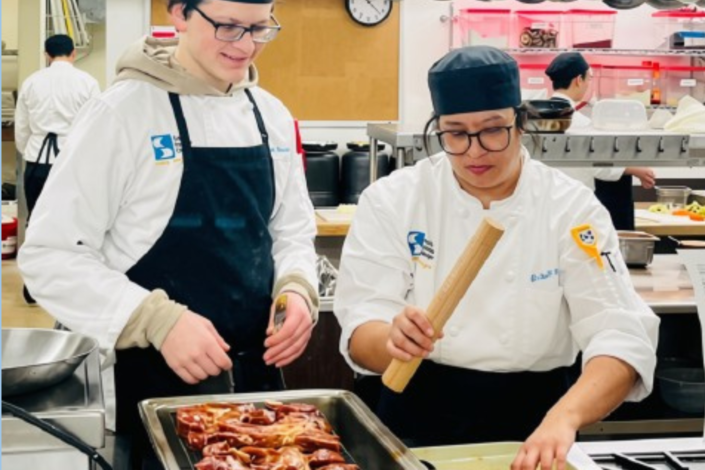 Culinary students working with Korean food ingredients
