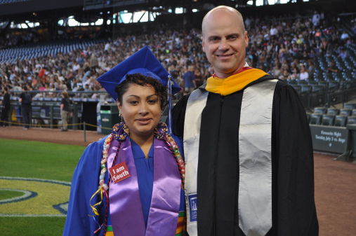 ANGEL DELKER WITH INTERIM PRESIDENT PETER LORTZ AT THE 2018 SEATTLE COLLEGES COMMENCEMENT CEREMONY. ANGEL DELIVERED ONE OF THREE STUDENT COMMENCEMENT ADDRESSES TO GRADUATES AND THEIR FAMILIES.